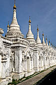 Myanmar - Mandalay, Sandamuni Pagoda. The entire ground is covered with 1749 small white pagodas with stone slabs with the Buddhist Tripitaka. 